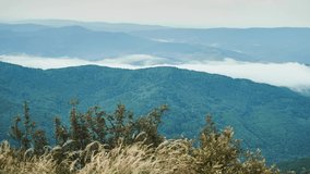 4k time lapse video of flying clouds over blue mountains. Beautiful nature background. 