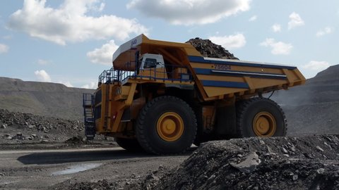 Kemerovo, Russia - August 2019. Kemerovo, Russia - August 2019. Heavy Dump Trucks At The Coal Mining Area.