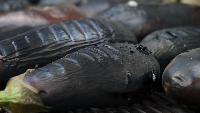 Baking eggplant on a grill. | Shutterstock HD Video #1059561374