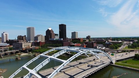 Rochester , NY / United States - 06 04 2016: Rochester NY skyline on a sunny summer day over the Genesee River. 