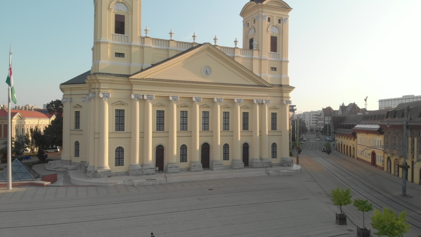 Aerial / drone footage of the Reformed Great Church, downtown Debrecen, second largest city and a major cultural center of Hungary, located in the Northern Great Plain region, Hajdú-Bihar county