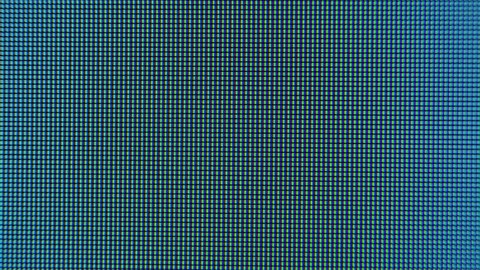 Old LCD pixels background. Macro shot of computer screen, pixel texture. Abstract rainbow background. Close the LED screen with Color Shades technology. Closeup monitor. Illumination wallpaper sample.