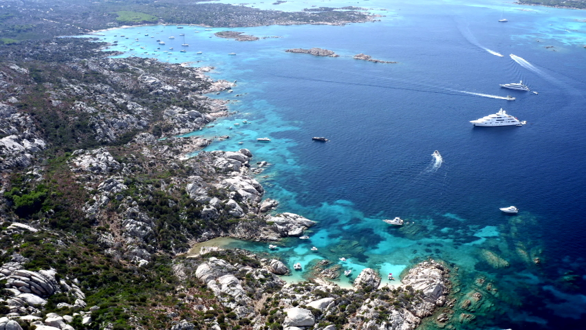 Beautiful Cinematic Aerial Drone View over Caprera Island, Sardinia, Italy.
Rocky Coastline. Turquoise Cristal Clear Sea.