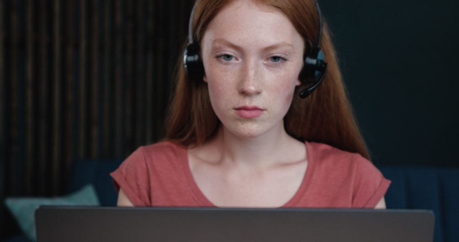 Shocked red-haired Business Analyst, Operator working focused on her Laptop. Close Up or female Ginger is getting some Problems while working Distantly. Online Job, Studying, Help. Royalty-Free Stock Footage #1059571217