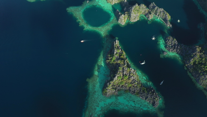 View from above, stunning aerial view of the Twin Lagoons surrounded by rocky cliffs. The Twin Lagoons are one of the must-see destinations in Coron Island. Palawan, Philippines.