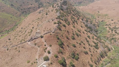 Ruins of the ancient Jewish city of Gamla on the ridge of a mountain in Galilee (Israel). Drone filming.