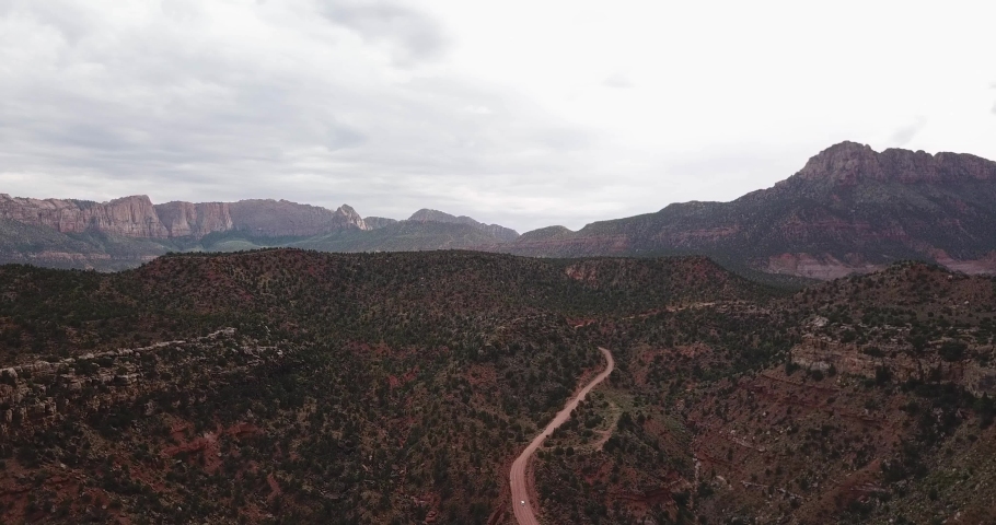Drone Aerial View on Hills and Mountains in Zion National Park Utah USA Under Cloudy Sky