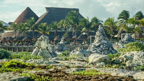 Stacks of zen rocks on the rocky beach of puerto aventuras in the Mayan Riviera in Mexico