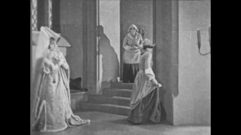 CIRCA 1923 - In this silent movie adaptation of the Hunchback of Notre Dame, Phoebus presents Esmeralda in disguise as a princess at a royal ball.