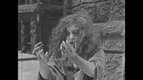 CIRCA 1923 - In this silent movie adaptation of the Hunchback of Notre Dame, a beggar woman recalls her aristocratic past when her baby was kidnapped.