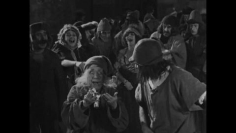 CIRCA 1923 - In this silent movie adaptation of the Hunchback of Notre Dame, the Court of Miracles is introduced as Clopin's underworld.