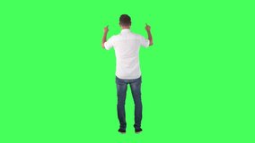 Back view of business man interacting with invisible touch screen interface. Full body on green screen chroma key background. - Powered by Shutterstock - Get 15% off with code: PIKWIZARD15