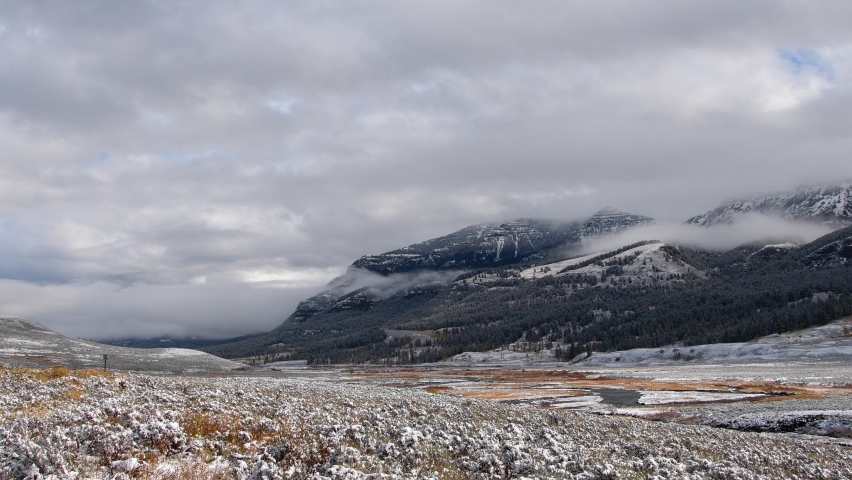 Late fall at Yellowstone National Park, in the Lamar Valley with a light dusting of snow. Camera panning left to right.