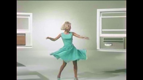 CIRCA 1960s - A woman dances among different models of air conditioners as a narrator describes their top-of-the-line nature in 1966.