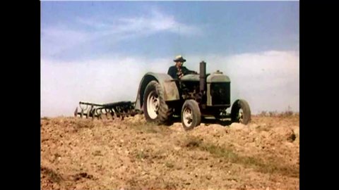 CIRCA 1950s - A farmer comes up with the idea to put rubber tires on his tractors and it becomes an industry standard.