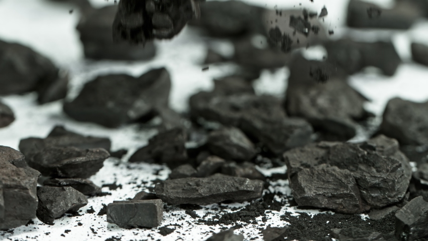Super Slow Motion Shot of Coal and Black Powder Falling on White Background at 1000 fps. Royalty-Free Stock Footage #1059607196