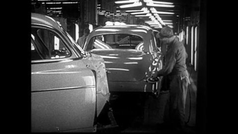 CIRCA 1950s - Factory workers in a Chevrolet plant buff new cars, and an outline for the car's skeletal structure is shown in 1950.