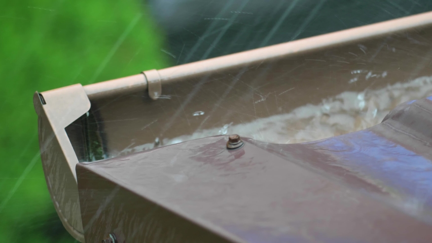 Heavy Rain Hitting House Roof and Rain Gutter During Thunderstorm Royalty-Free Stock Footage #1059621029