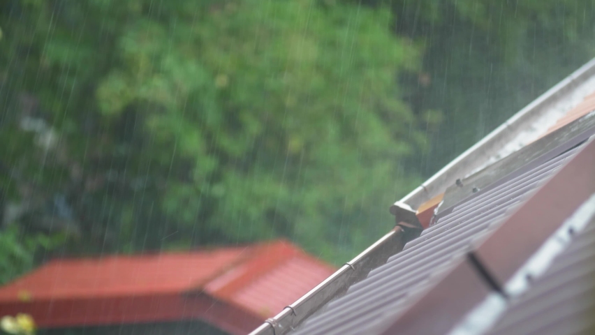Heavy Rain Hitting House Roof and Rain Gutter During Thunderstorm Royalty-Free Stock Footage #1059621044