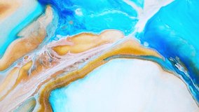 Fluid art drawing video, trendy acrylic texture with colorful waves. Liquid paint mixing backdrop with splash and swirl. Detailed background motion with golden, white and blue overflowing colors.