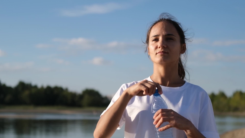 Close up portrait of active woman while relaxing after sports