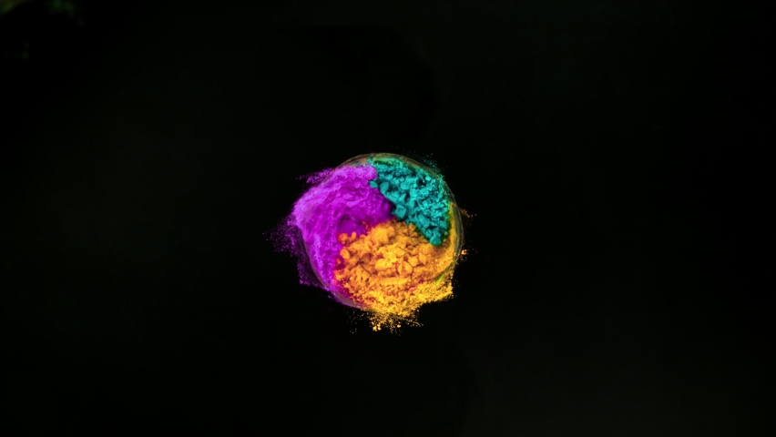 Super slow motion of coloured powder rotation isolated on black background. Filmed on high speed cinema camera, 1000fps. Royalty-Free Stock Footage #1059630143