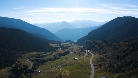 Aerial view of natural mountain valley with serpantine road, Encamp, Andorra