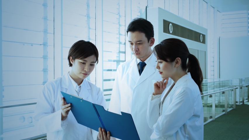 Group of doctors meeting in hospital. Medical technology concept. Remote medicine. Electronic medical record. Royalty-Free Stock Footage #1059655061