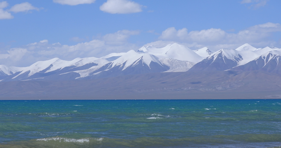 Snow capped mountain and lake landscape