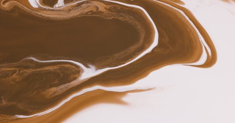 Abstract liquids mixing, White and caramel brown fluid. Coffee, Chocolate, Caramel, Chocolate splash concepts.
