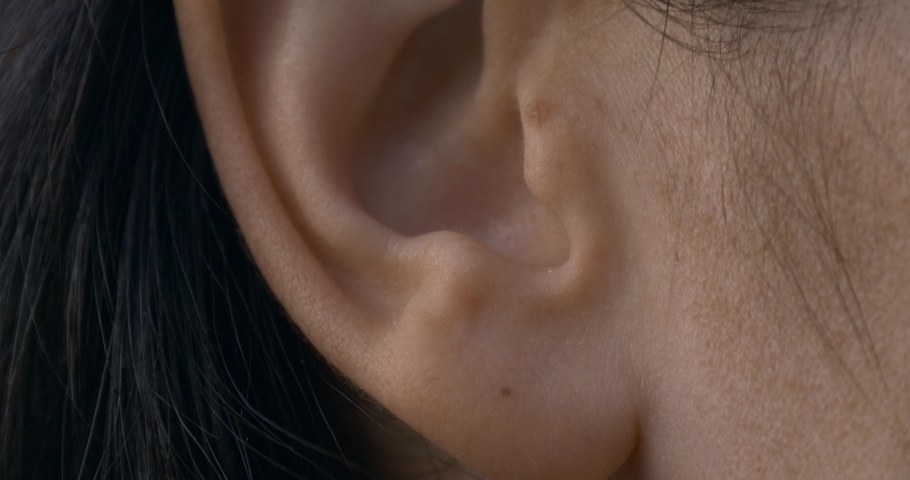 Close-up Female Ear. Outdoors Natural Lighting Morning Evening Time Royalty-Free Stock Footage #1059672518