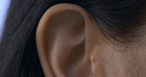 Close-up Female Ear. Outdoors Natural Lighting Morning Evening Time