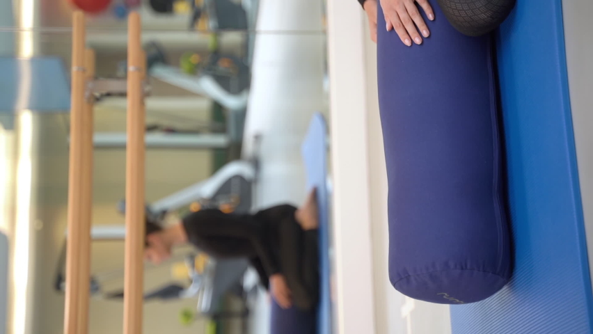 woman doing exercises for pregnant women in the gym. vertical video