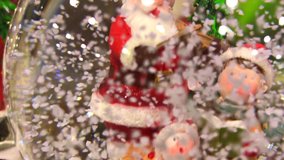 Glass gift snow globes with Santa Claus decorative wonderful interesting various gift objects Macro Detail shot HD video buying different perspective angles.