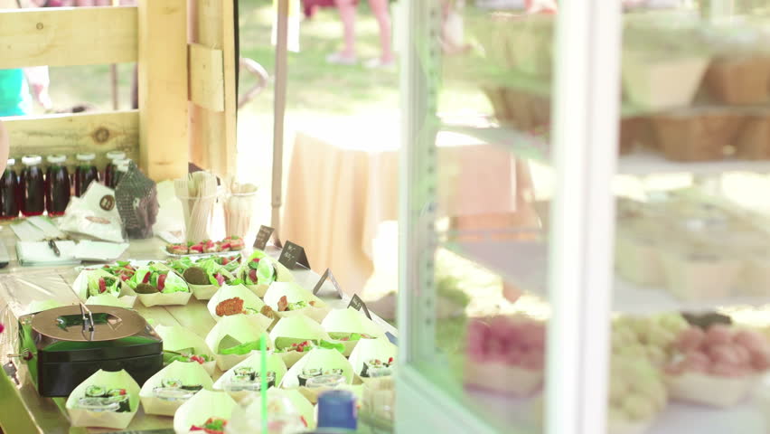 Caucasian woman selling raw food in the food stand