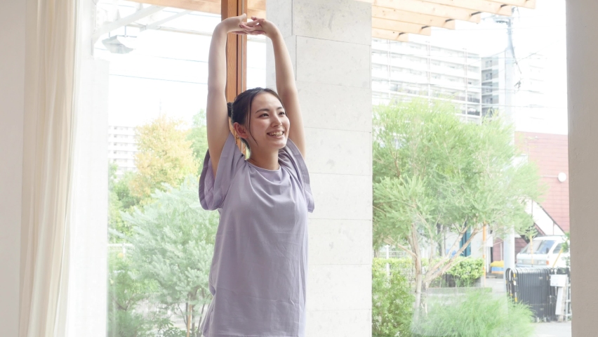 Asian woman exercising at home Royalty-Free Stock Footage #1059694283