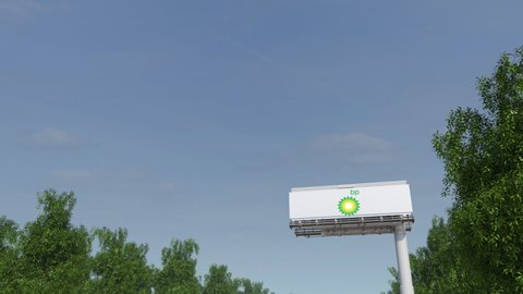 MOSCOW, RUSSIA - CIRCA 2020. Airliner flies over billboard with Bp logo