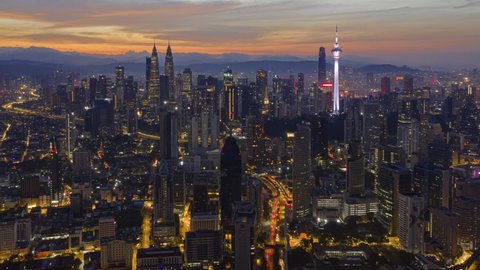 Beautiful City Time lapse: Aerial Kuala Lumpur view during dawn overlooking a city skyline in Federal Territory, Malaysia. Hyperlapse. High quality, Pan up motion timelapse. Prores 4KUHD