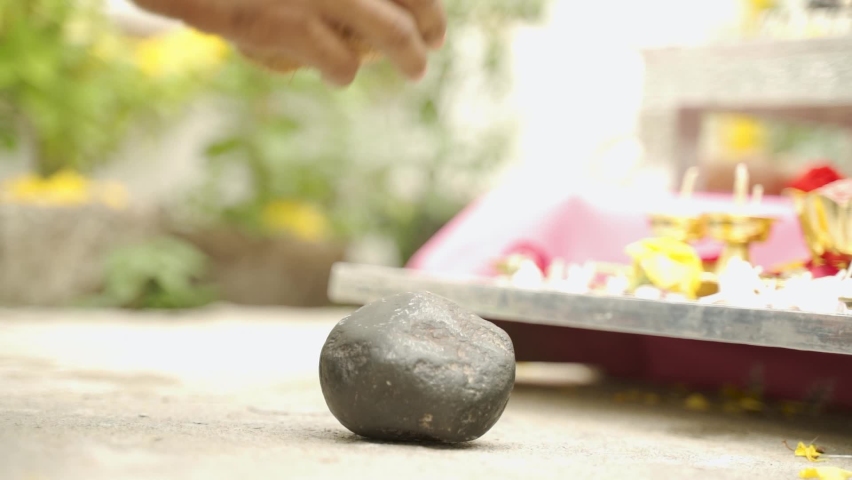 Close up of Hands offering or hitting Coconut to stone in front of god - breaking a coconut represents complete surrender to God in Hindu religion Royalty-Free Stock Footage #1059701108