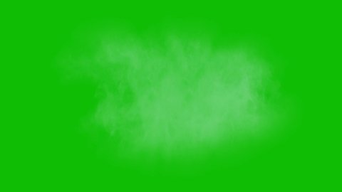Dusty bullet hits on a wall with chunks of debris flying out . Powder explosion on green screen background.Impact dust particles. Dust explosion in front of black background, slow-motion close up. VFX