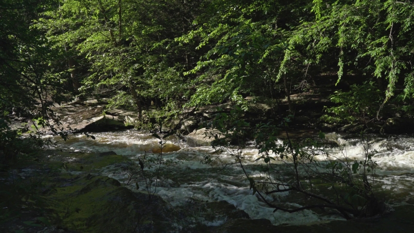 Water rapidly flowing down stream at Jean Petit State Park in Arkansas