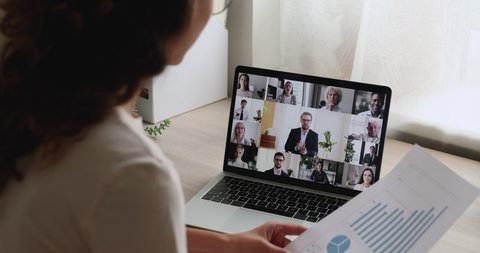 Woman lead virtual meeting with multi ethnic business partners. Team discuss project, financial stats of company brainstorm together at group briefing by videoconference, teamwork modern tech concept