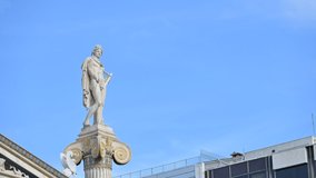  Athens, Greece. Time-lapse footage of ancient Greek god Apollo statue with blue sky and clouds passing by.4k resolution video.