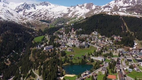 Aerial footage of the famous Arosa ski resort and village in Canton Graubunden in the alps in Switzerland in summer. Shot with a rotation motion