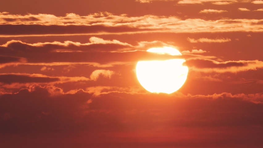 Sunrise 4k. Clouds and Sun Rising Sky Time Lapse. Closeup Telephoto Lens. Travel, Beginning, Nature Concept. Location: Southern Sweden.  Royalty-Free Stock Footage #1059718130