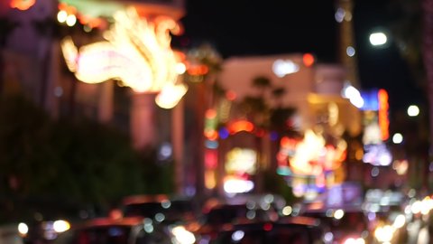 Defocused fabulous Las Vegas Strip boulevard, luxury casino and hotel, gambling area in Nevada, USA. Nightlife and traffic near Fremont street in tourist money playing resort. Neon lights of sin city.