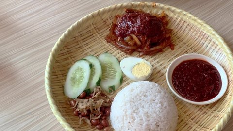 Nasi Lemak with cuttlefish. Coconut rice, a popular cuisine in Malaysia and Indonesia.