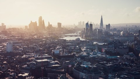 Establishing Aerial View Shot of London UK, smooth sunrise, whole city skyline from Mayfair, United Kingdom