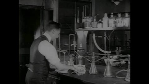 CIRCA 1920s - Chemists work in a lab on a dynamite plant in the 1920s.