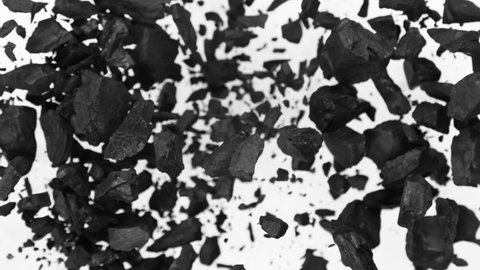 Super Slow Motion Shot of Coal Explosion Isolated on White Background at 1000 fps.